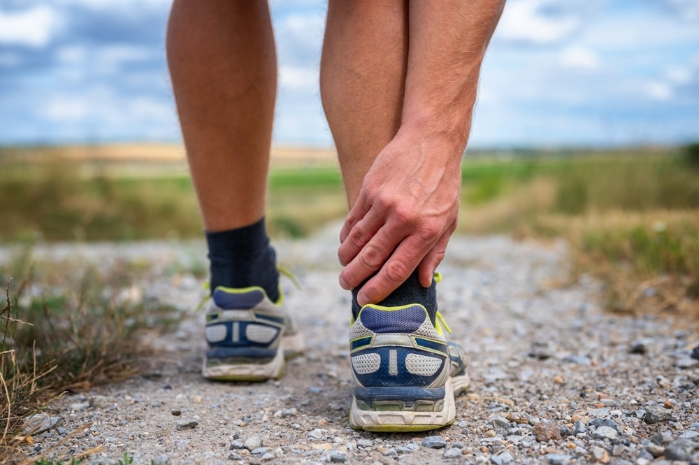 Jogger with achilles tendon pain