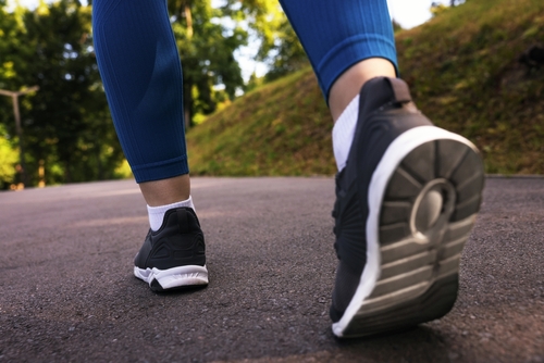 Woman's leg hurts, pain in the heel, massage of female feet